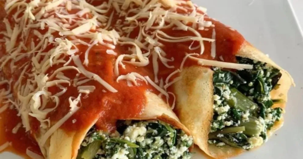 Te enseñamos a hacer el plato más clásico de invierno: una fácil receta de canelones con espinaca, ricota y boloñesa